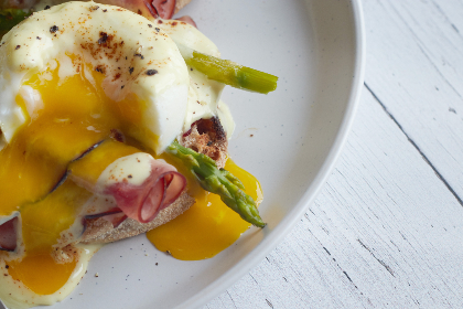 breakfast, eggs, plate, benedict, dish, food, ham, brunch, poached, muffin, hollandaise, meal, toast, bread, asparagus, vegetable, gourmet, eating, yolk